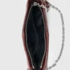 Bolsa Miss M Pouch em couro envernizado