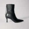 Botas de cano curto em pele