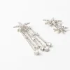 Brincos de estrela com strass