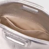 Micro bolsa Miss M em pele metalizada