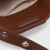 Mini-bolsa de couro com tachas Miss M