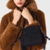 Sobretudo de pele sintética de comprimento médio