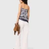 Top com estampado de frutas e smock